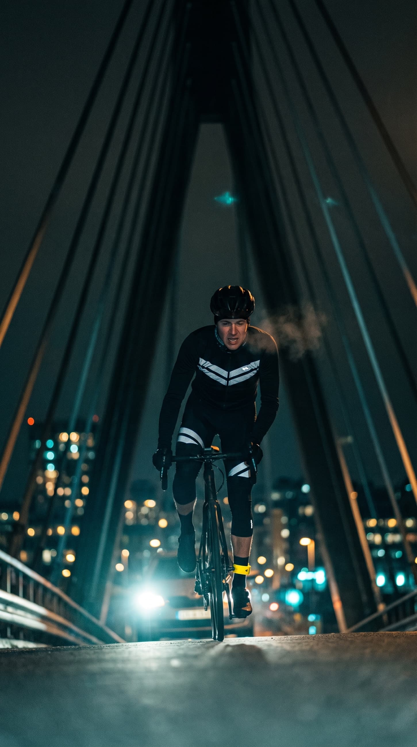 Vertical ad for Afterlight, a low-angle bridge climb with converging cables and breath in the cold air