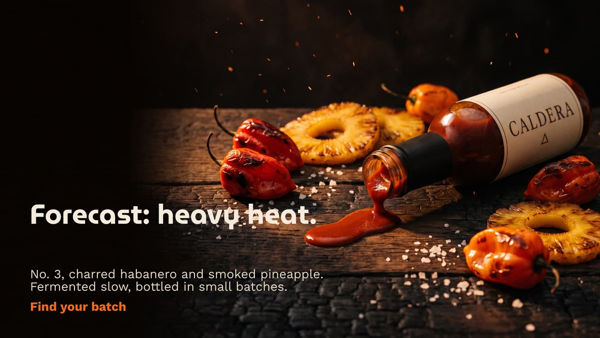 Web banner for Caldera hot sauce, the bottle spilling a sauce ribbon on charred oak beside the line forecast: heavy heat